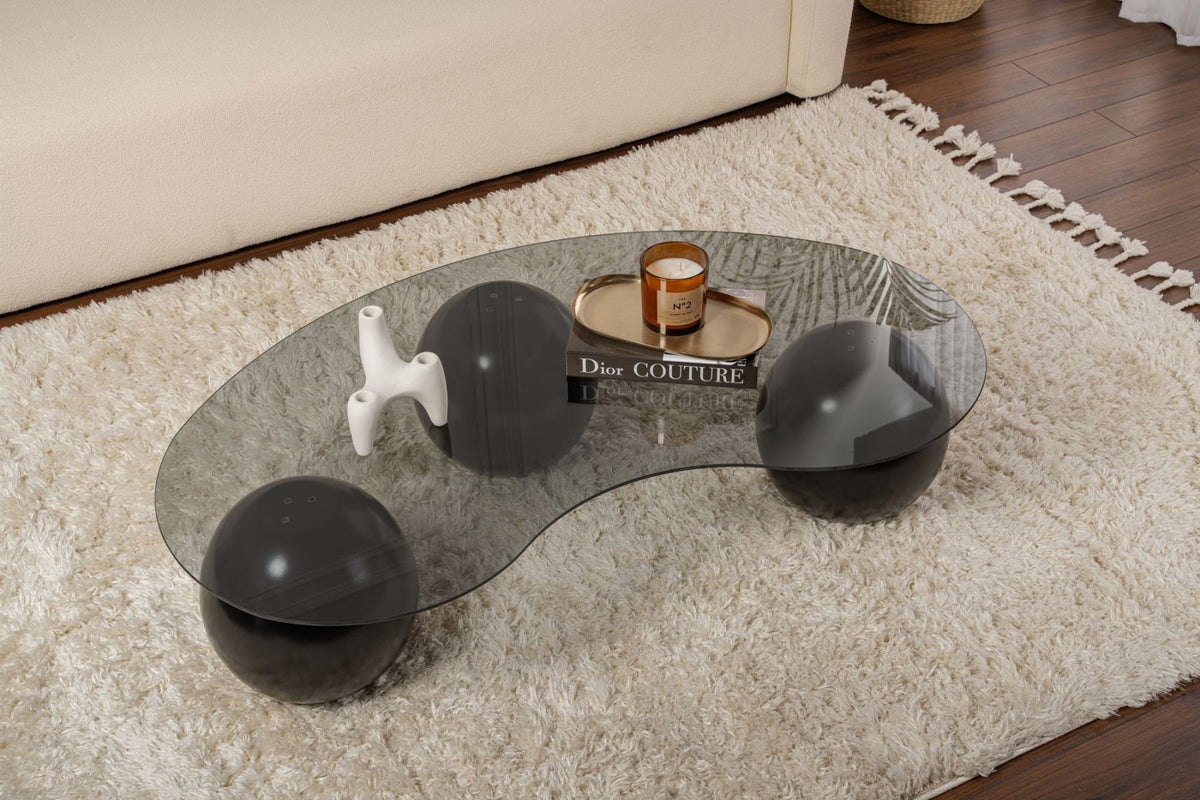 Coffee tables - Organic coffee table gray tinted glass black ball legs Sphere 120x70 cm - Dimehouse