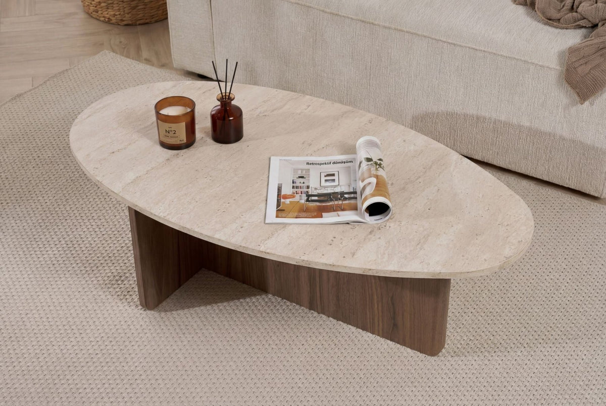 Organic pebble-shaped coffee table with a travertine-look top and walnut melamine base. Japandi design of 120x60cm.