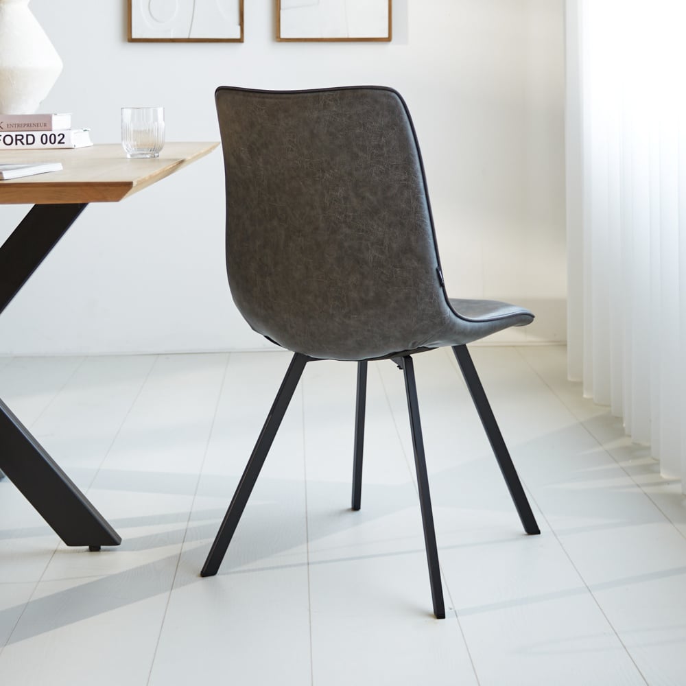 Dining room chair Jimmy Faux leather Dimehouse Anthracite LxWxH 75x57x51 Faux leather Atmospheric photo diagonal rear view