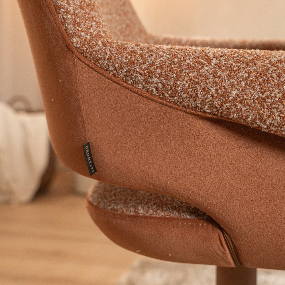 Eetkamerstoel Jules draaibaar bouclé terracotta Bouclé
