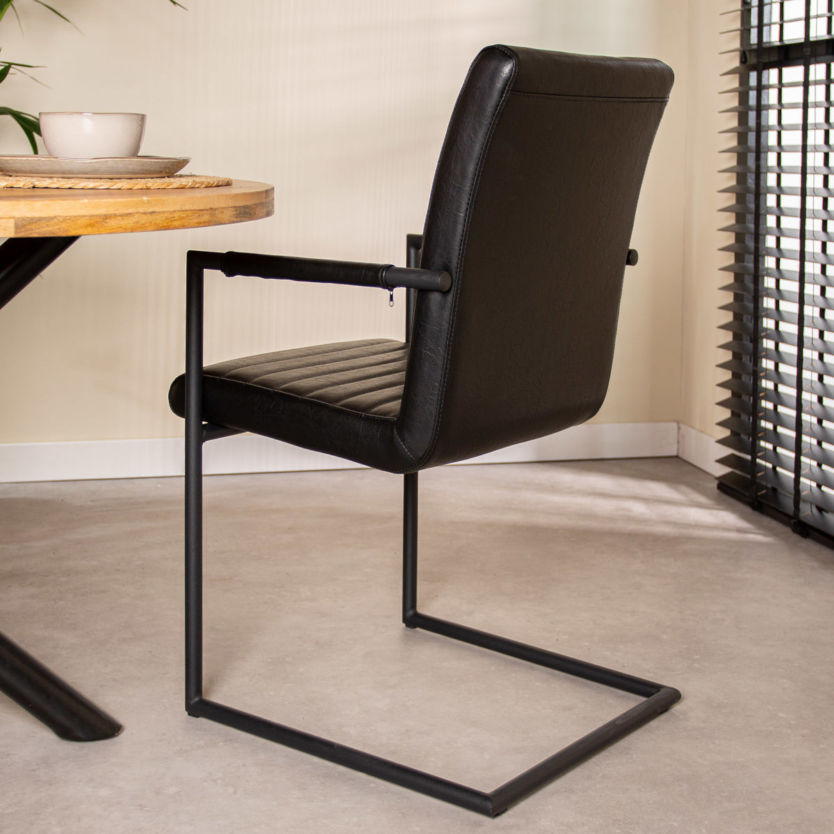 Dining room chair Bras Dimehouse Black LxWxH 73x59x58 Faux leather Atmospheric photo diagonal rear view