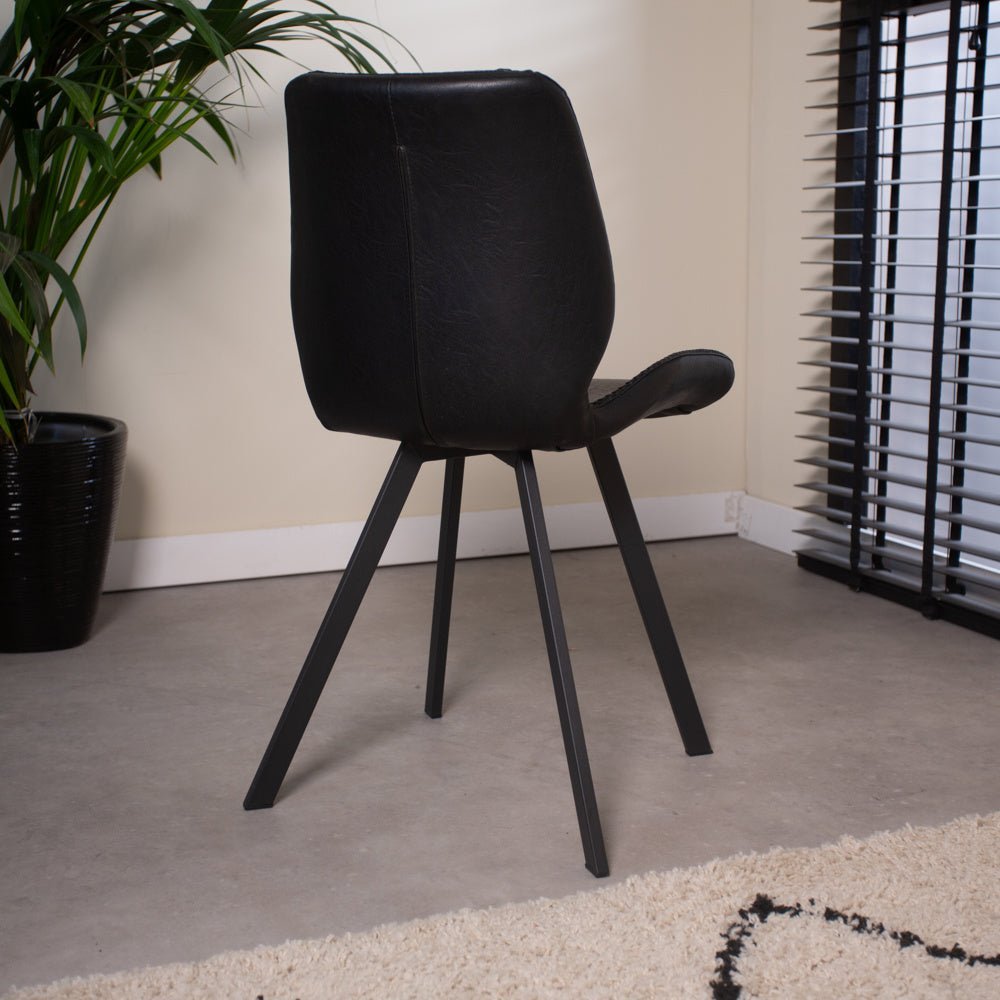 Dining room chair Barry Dimehouse Black LxWxH 69x66x48 Faux leather Atmospheric photo diagonal rear view