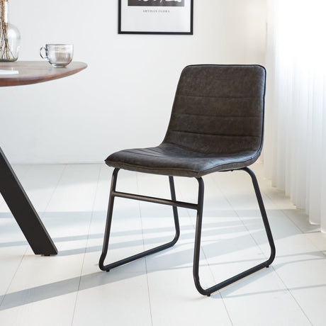 Dining room chair Mark Dimehouse Anthracite LxWxH 74x56x54 Faux leather Atmospheric photo diagonal front view