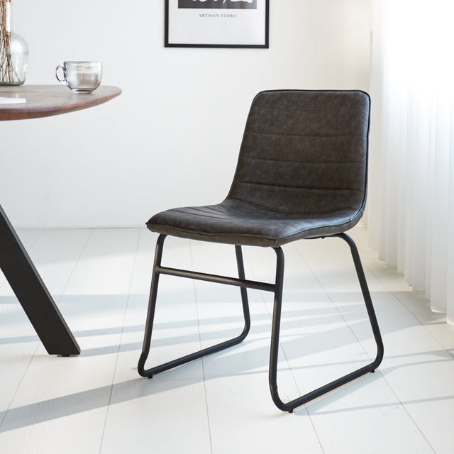 Dining room chair Mark Dimehouse Anthracite LxWxH 74x56x54 Faux leather Atmospheric photo diagonal front view