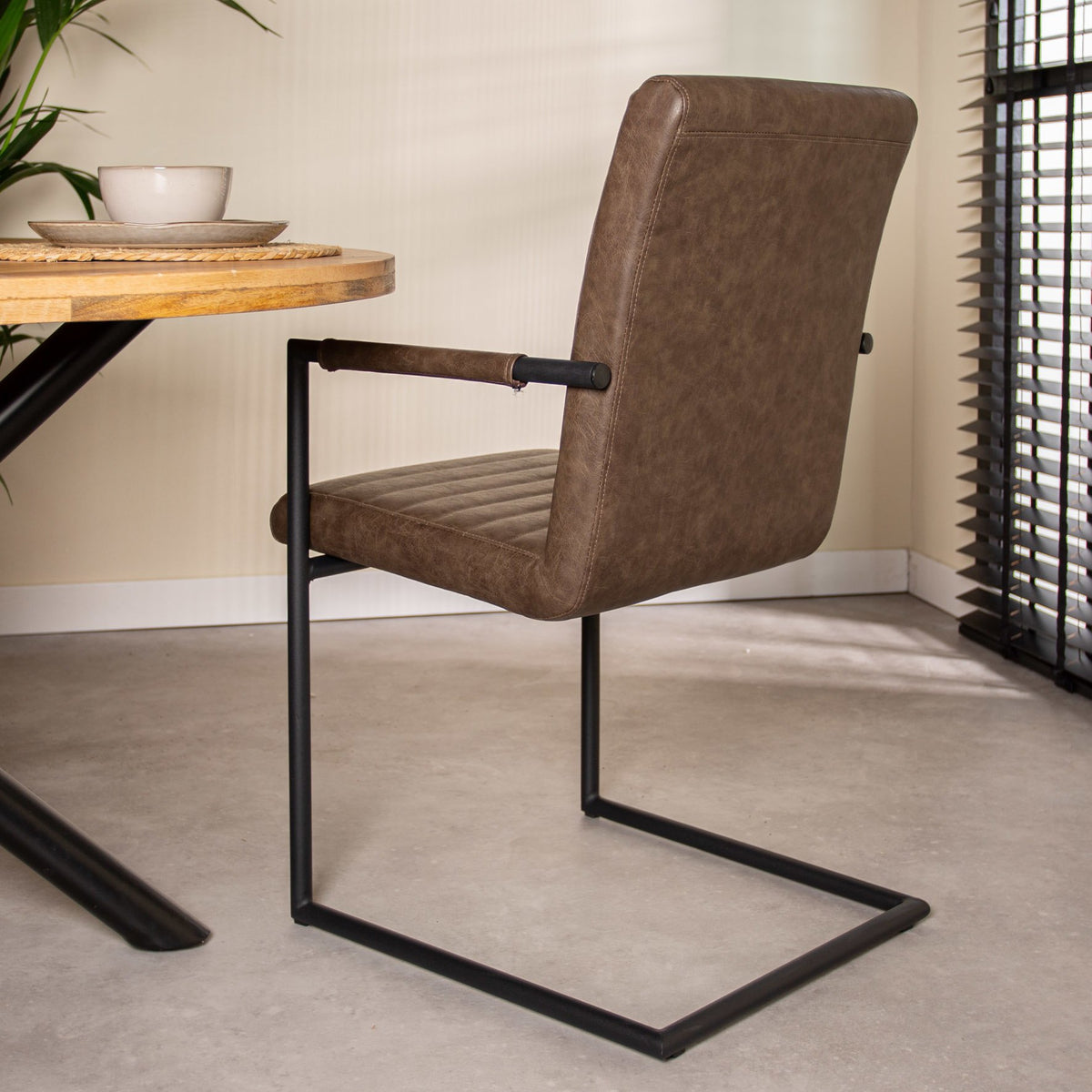 Dining room chair Bras Dimehouse Taupe LxWxH 73x59x58 Faux leather Atmospheric photo diagonal rear view