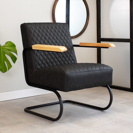 Armchair Lars Dimehouse Black LxWxH 68x64x39 Faux leather Atmospheric photo diagonal front view